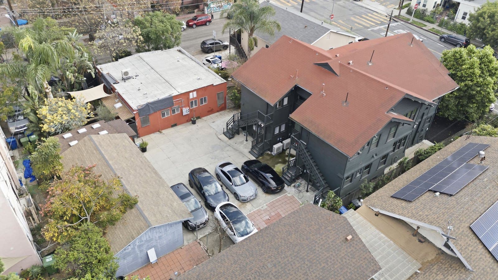 Aerial view from the northeast showing the roofline and rear parking