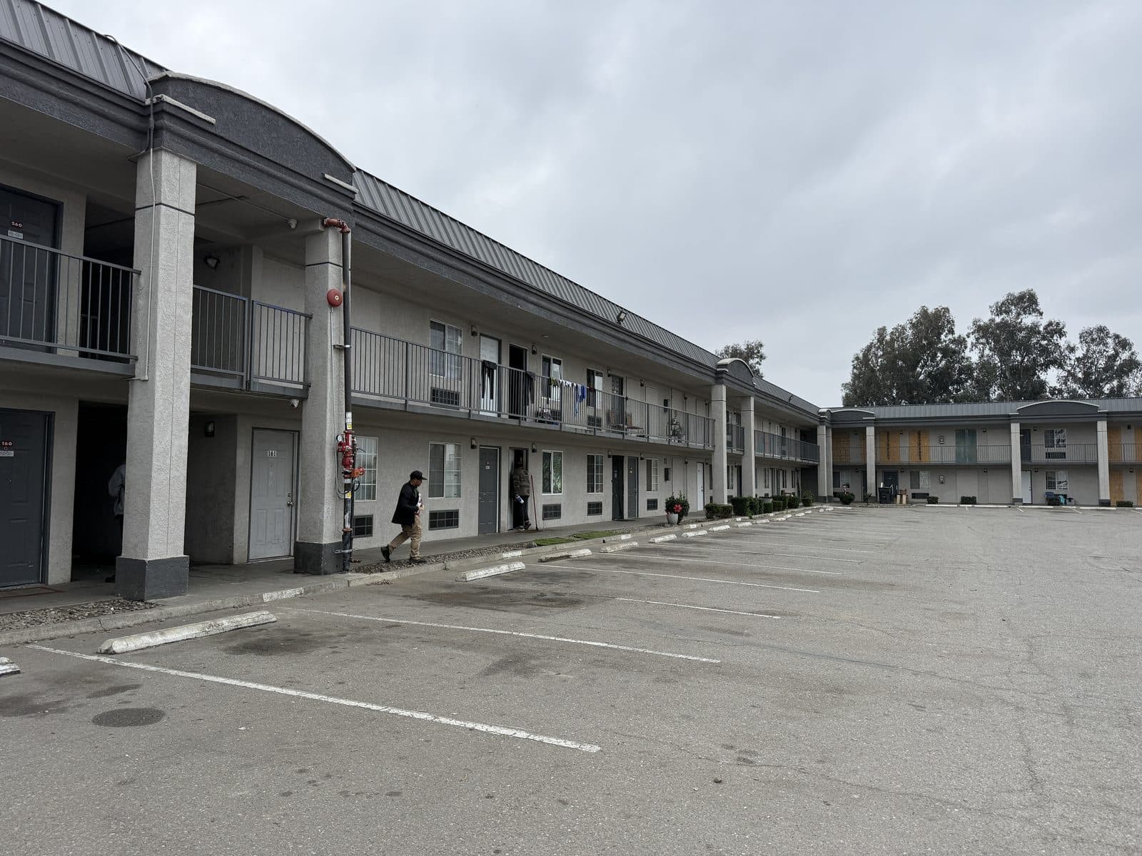 Open courtyard and exterior corridors between the two-story wings