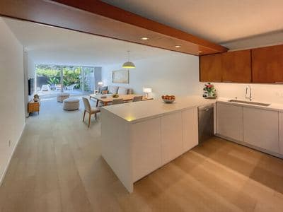 Open-concept unit living room and island kitchen