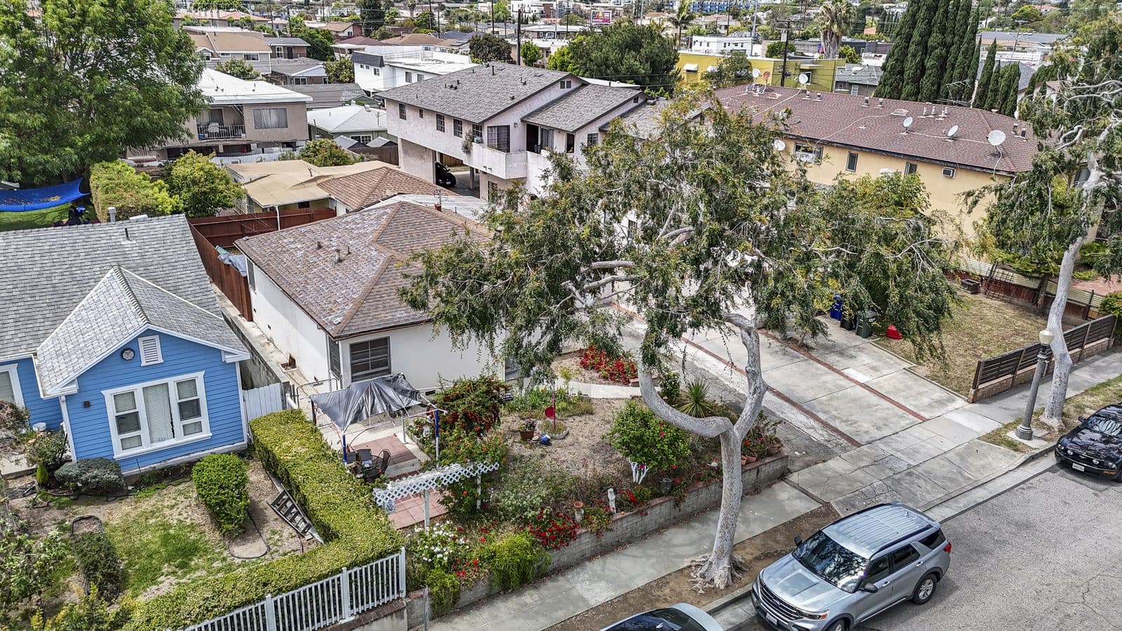 Low aerial of 3837 College Ave and the surrounding street