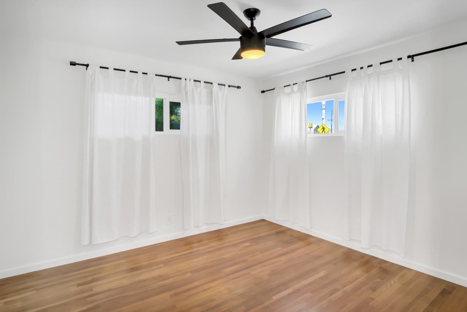 Bedroom with new double-pane windows and hardwood floors