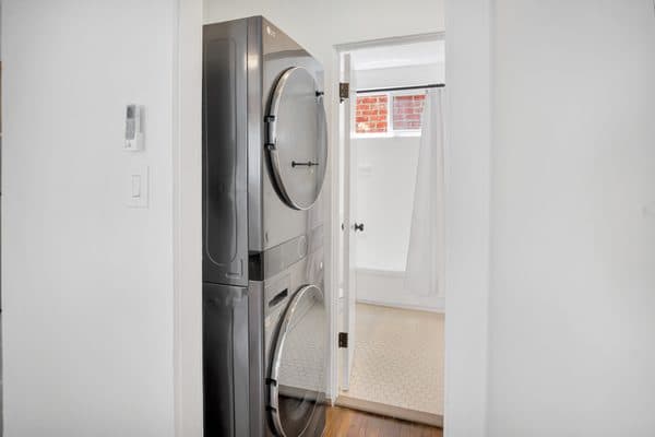 In-unit stacked washer and dryer